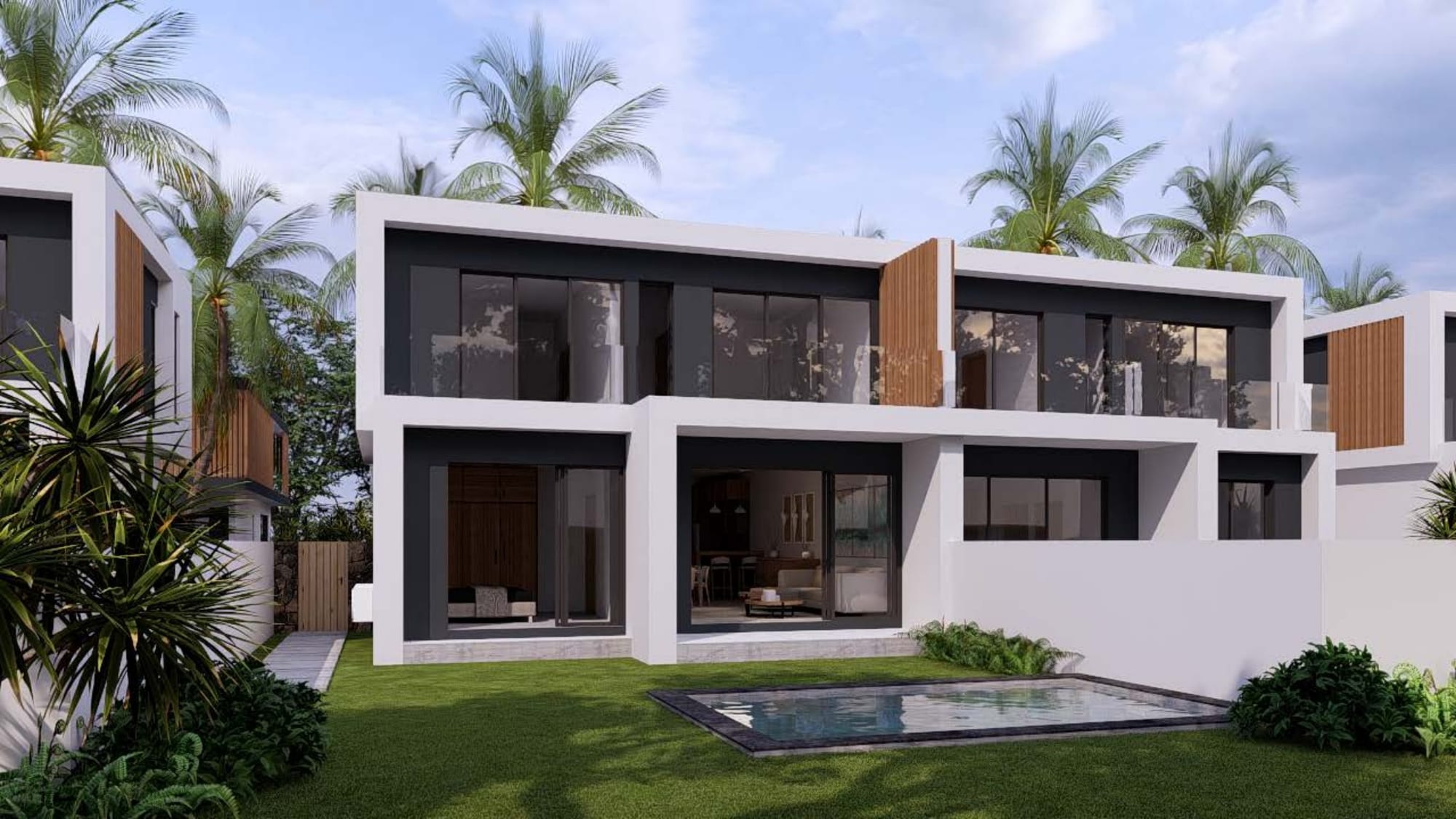 Rear elevation of a residence with lawn and plunge pool